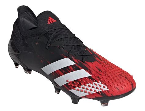 Red football cleats for men. . Red adidas cleats